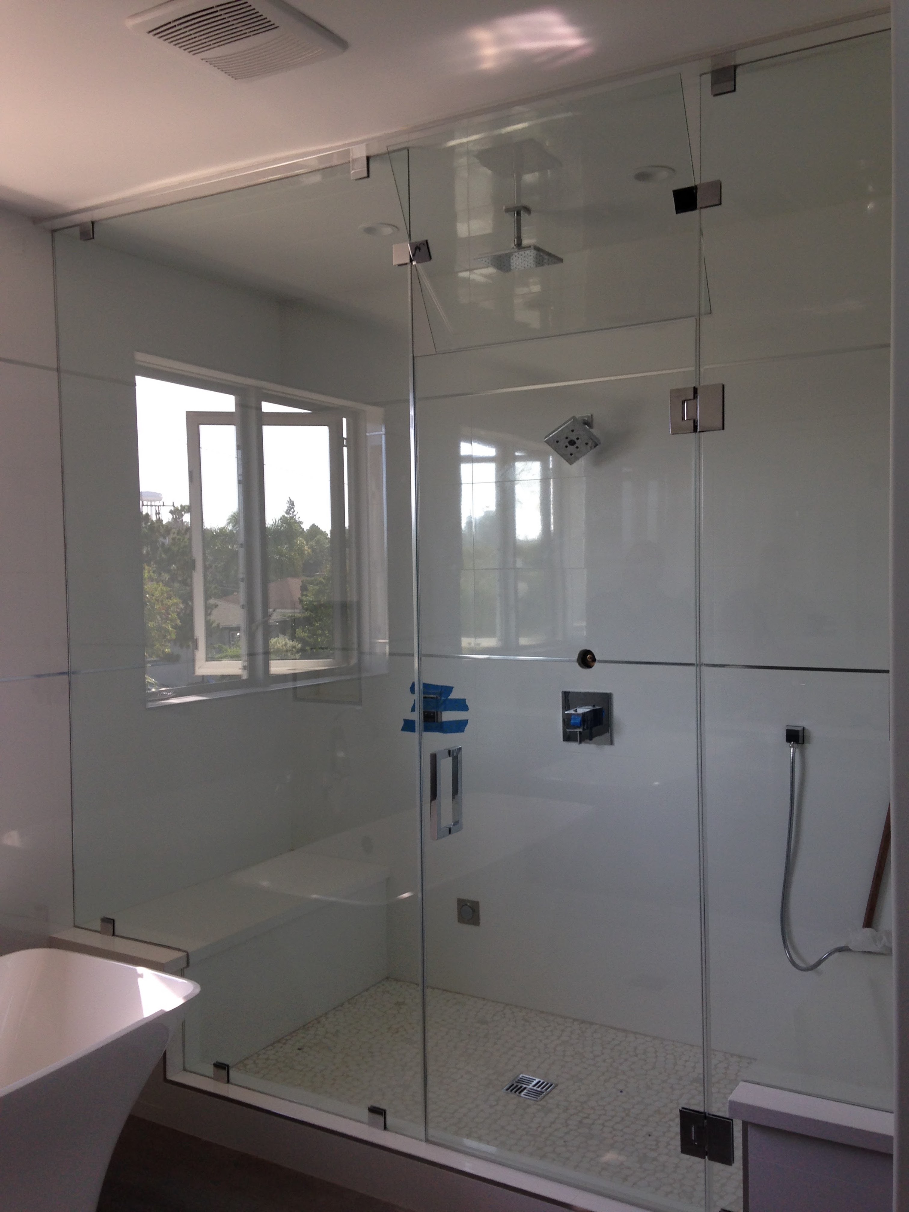 Custom shower door with three glass panels and a vent option
